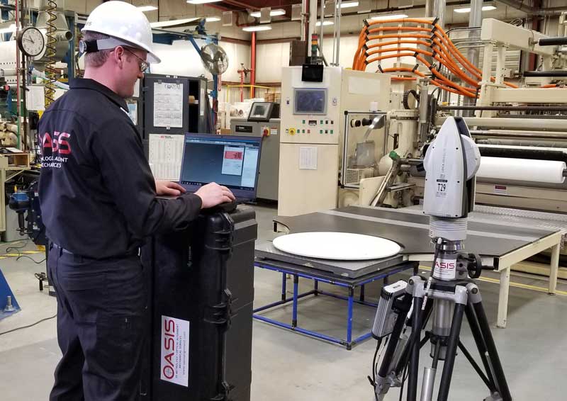 OASIS metrology engineer uses laser tracker to capture roll alignment data